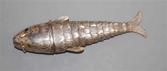 An Edwardian Hanau silver reticulated fish pill box, with cabochon eyes, import marks for London, 1902, 12.5cm.